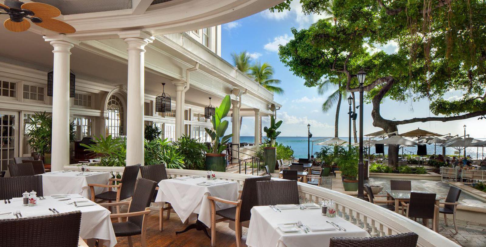 a restaurant with tables and chairs on a patio