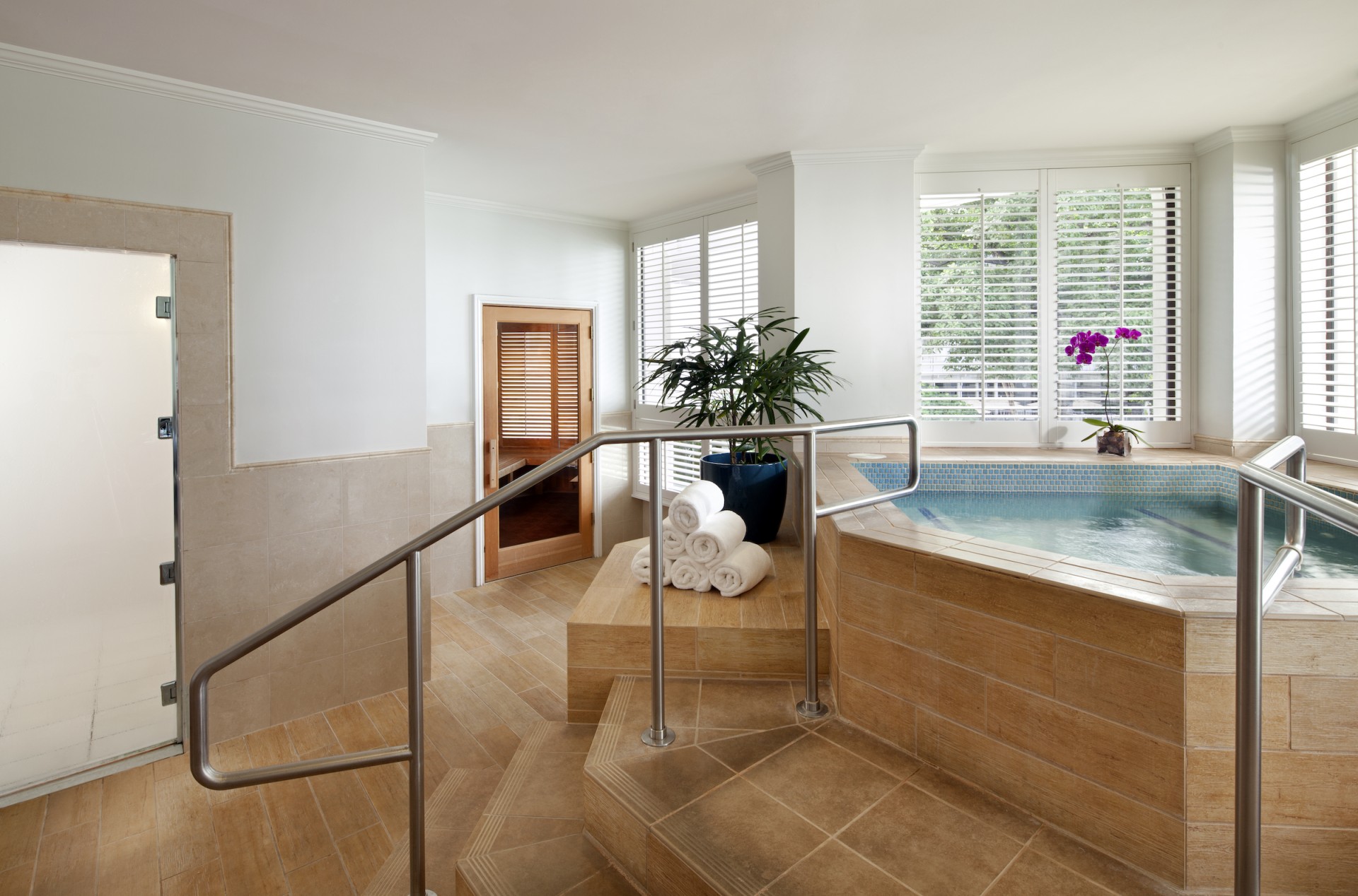 a indoor pool with a railing