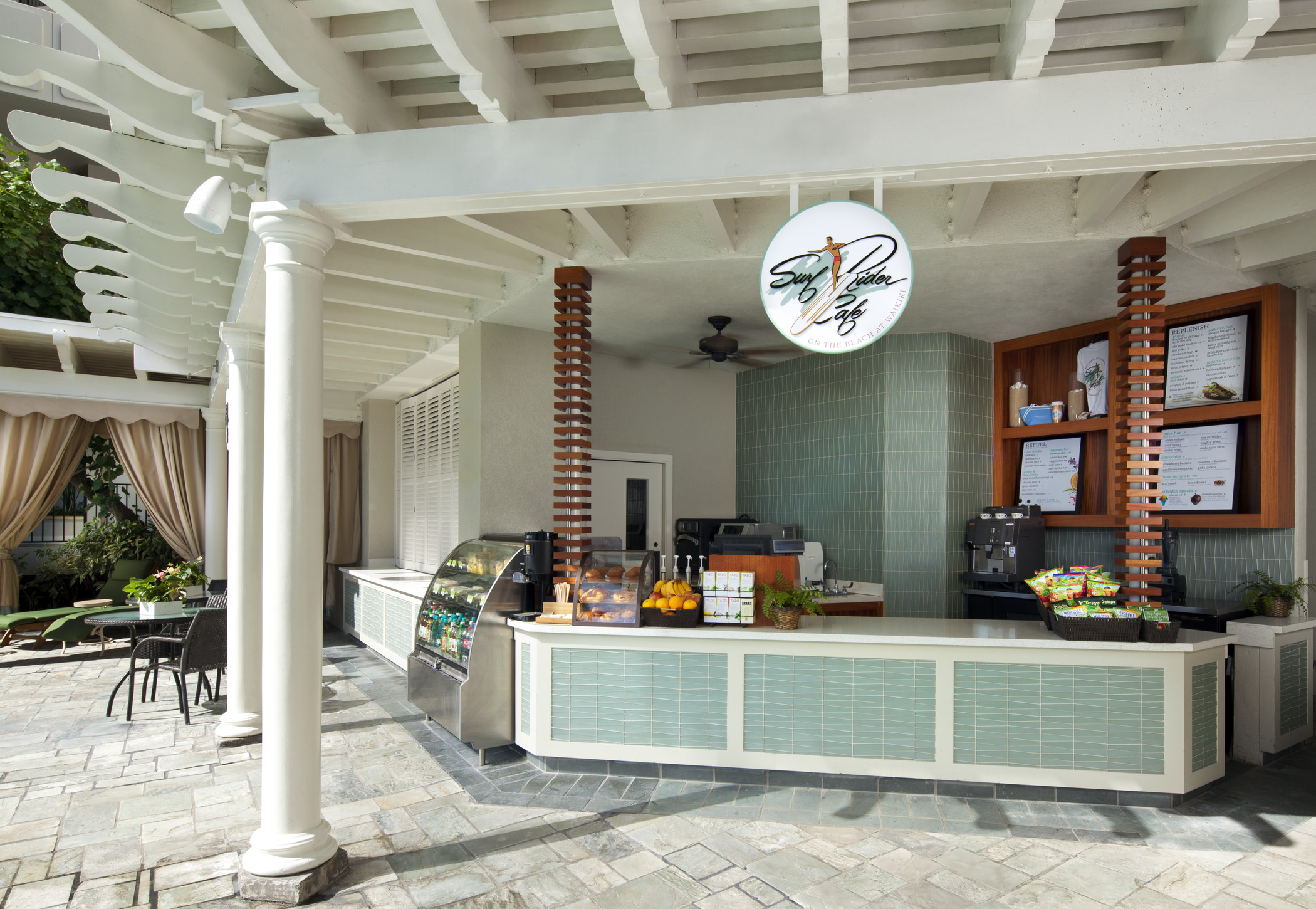 a restaurant with a counter and a sign