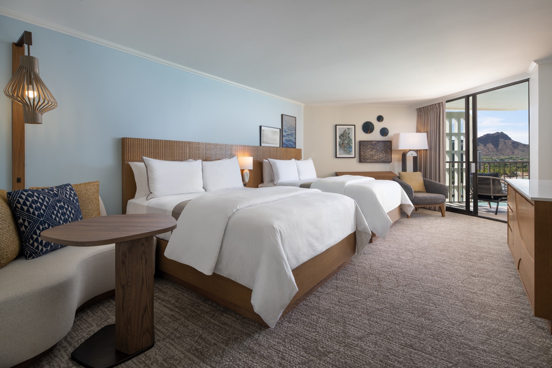 a hotel room with two beds and a table