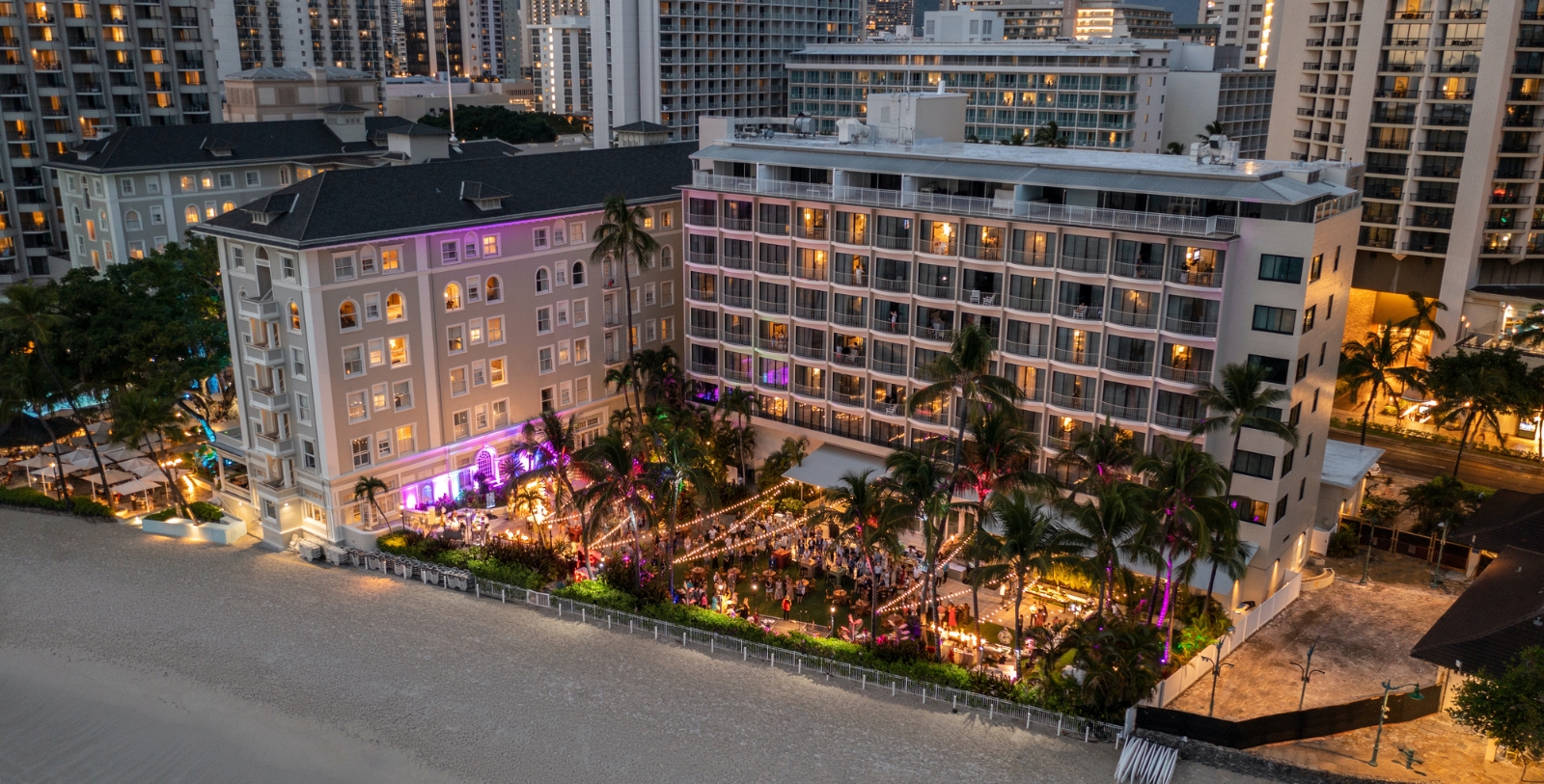 a group of people outside a hotel