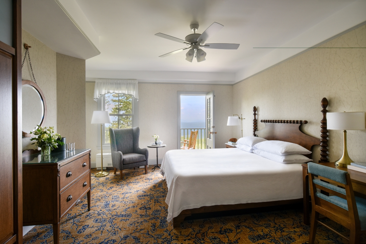 a room with a bed and a chair