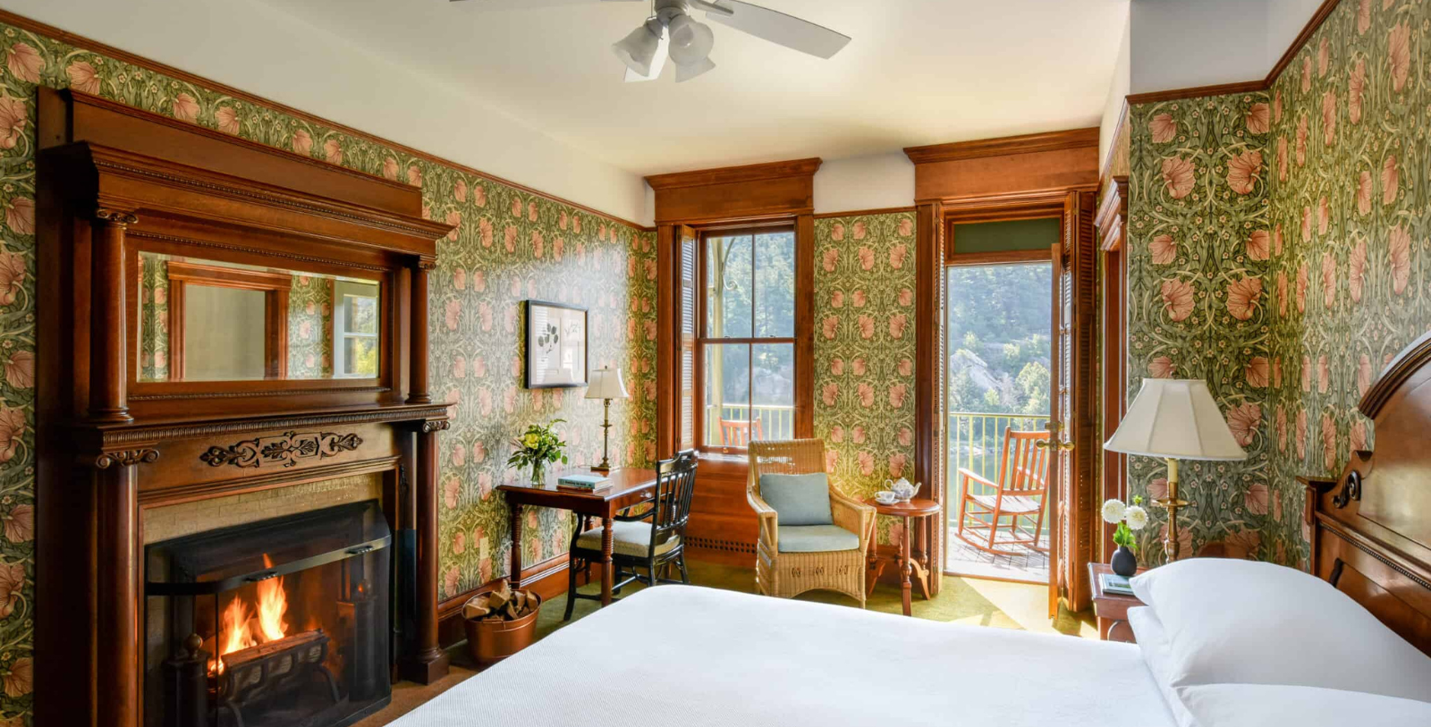 a room with a fireplace and a bed
