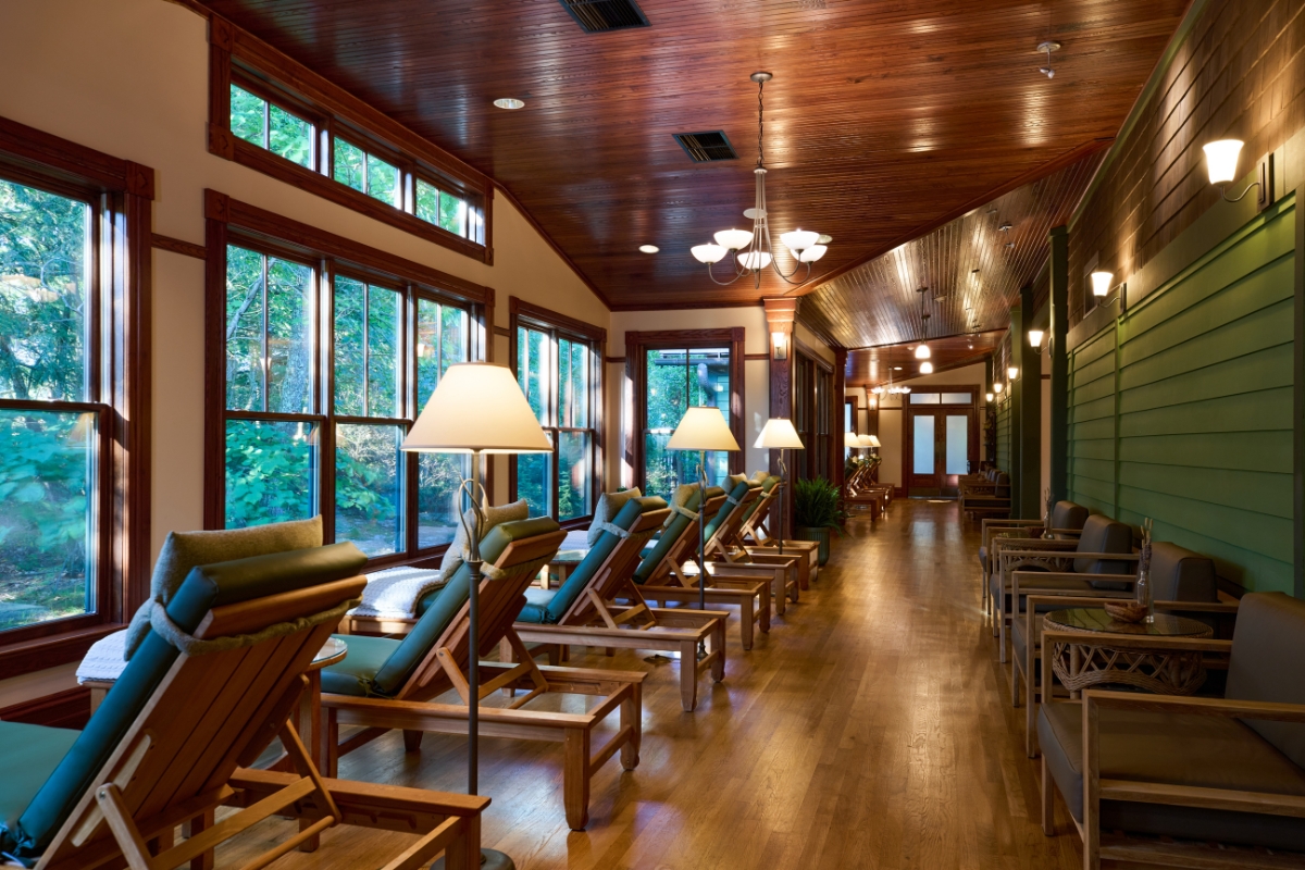 a room with chairs and lamps