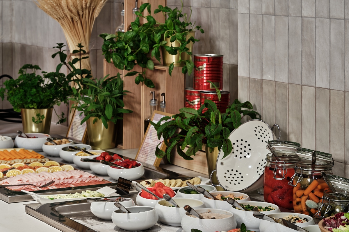 a buffet table with food and plants