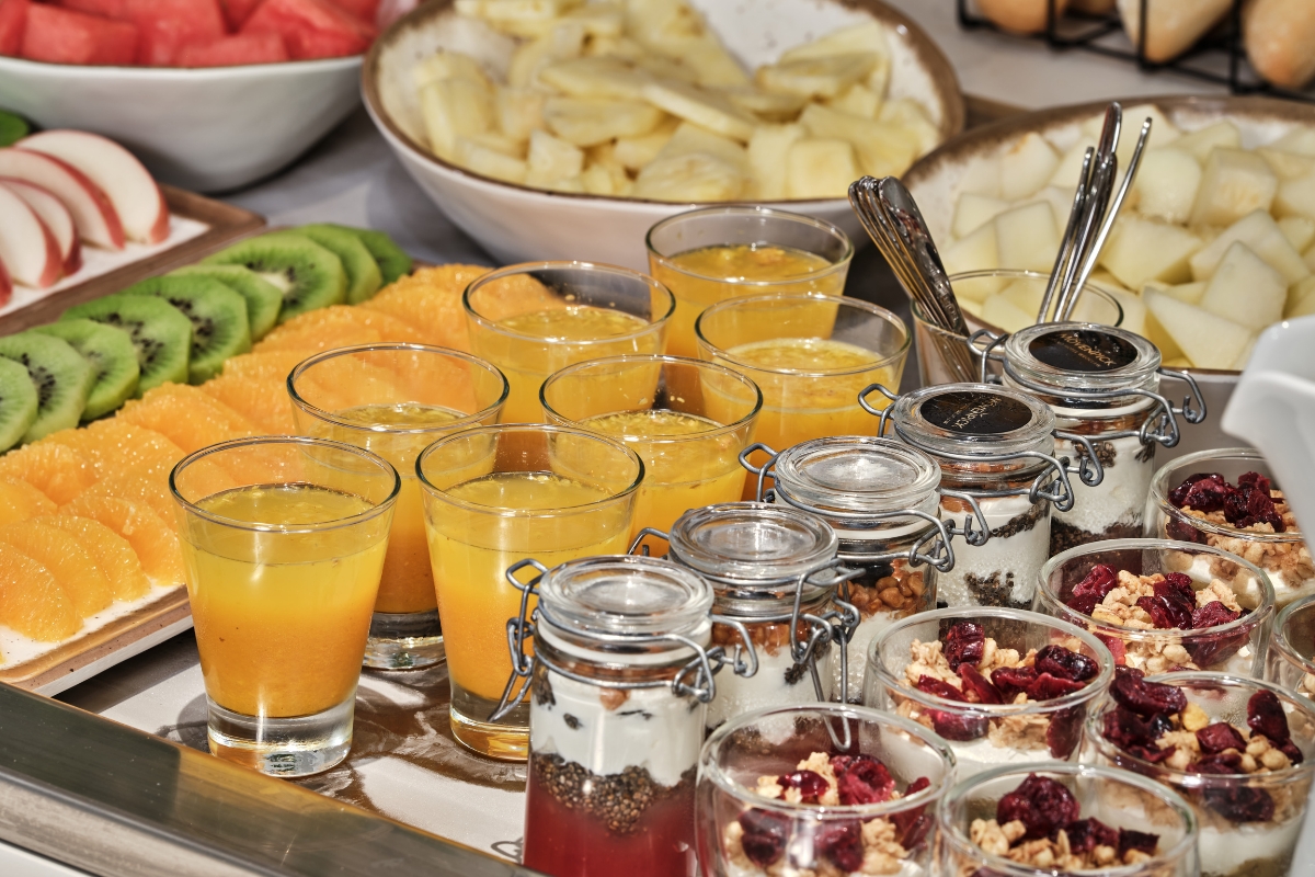 a table full of fruit and juice