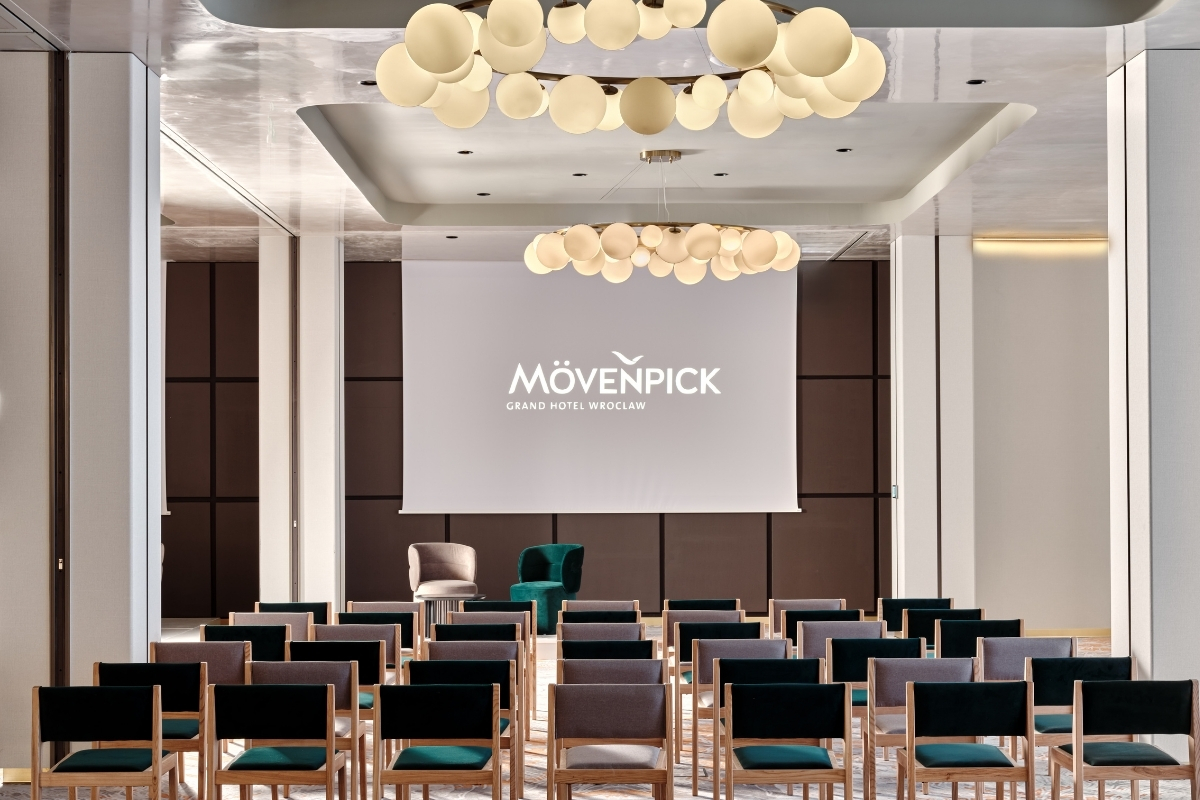 a room with chairs and a projector