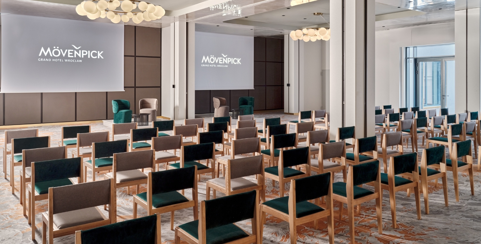 a room with chairs and a projector screen
