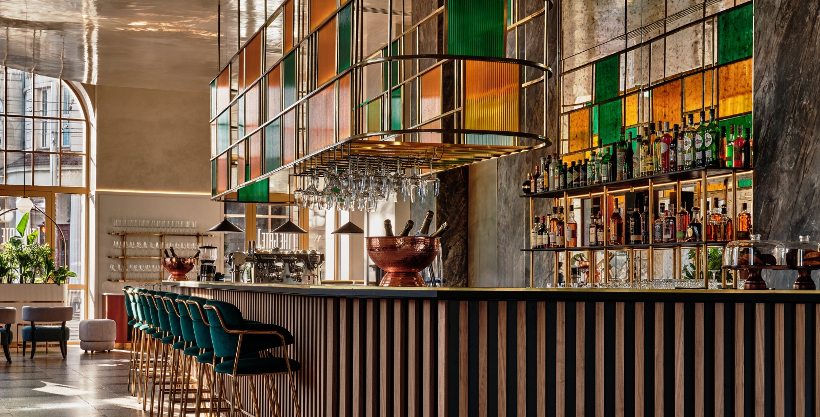 a bar with wine glasses from the ceiling