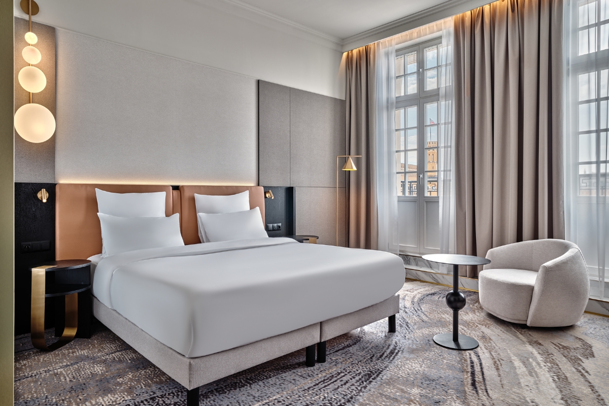 a room with a bed and a chair