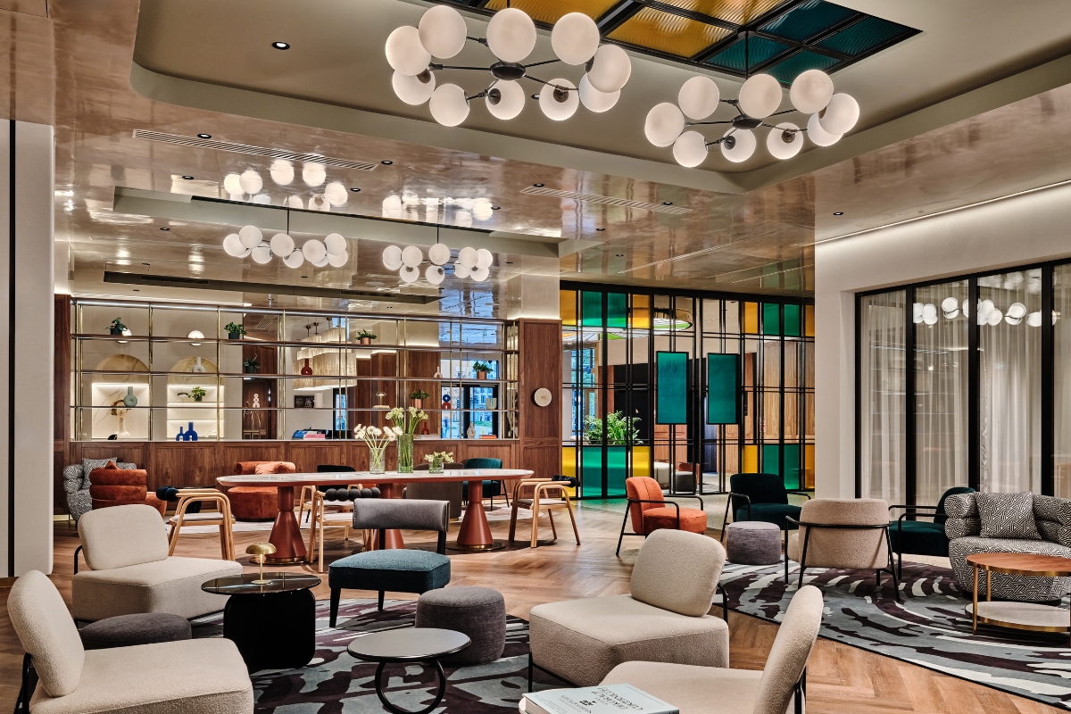a room with a large group of chairs and tables