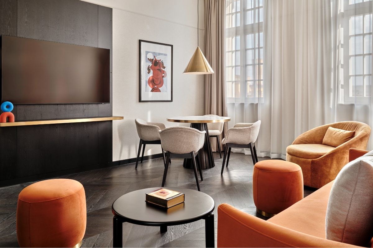 a room with a tv and couches