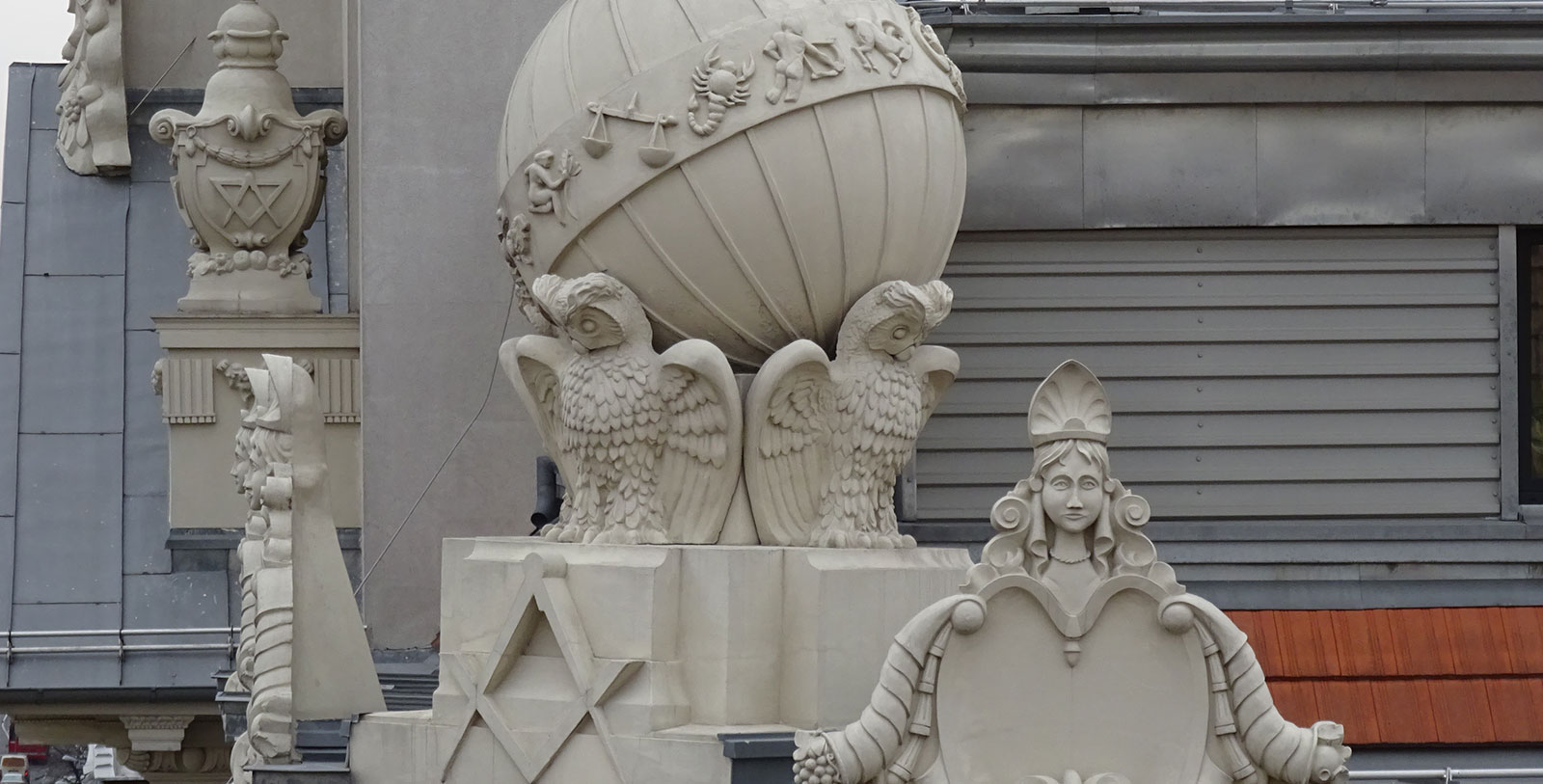 a statue of a woman and a globe