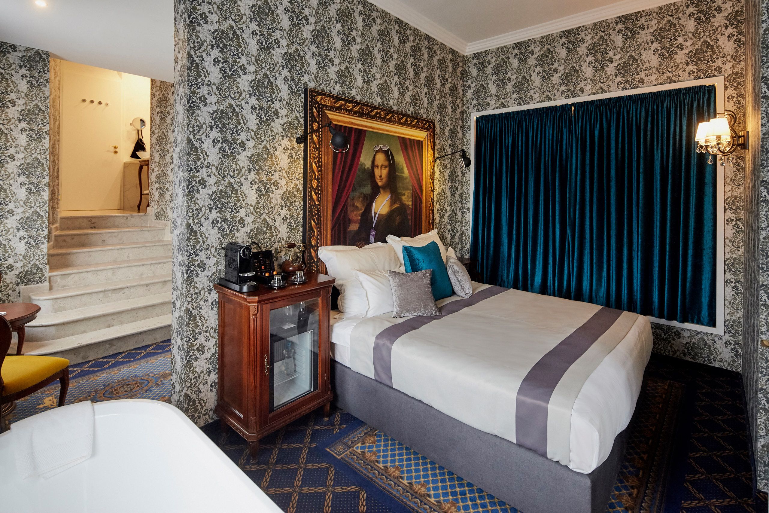 a bed with a picture on the wall