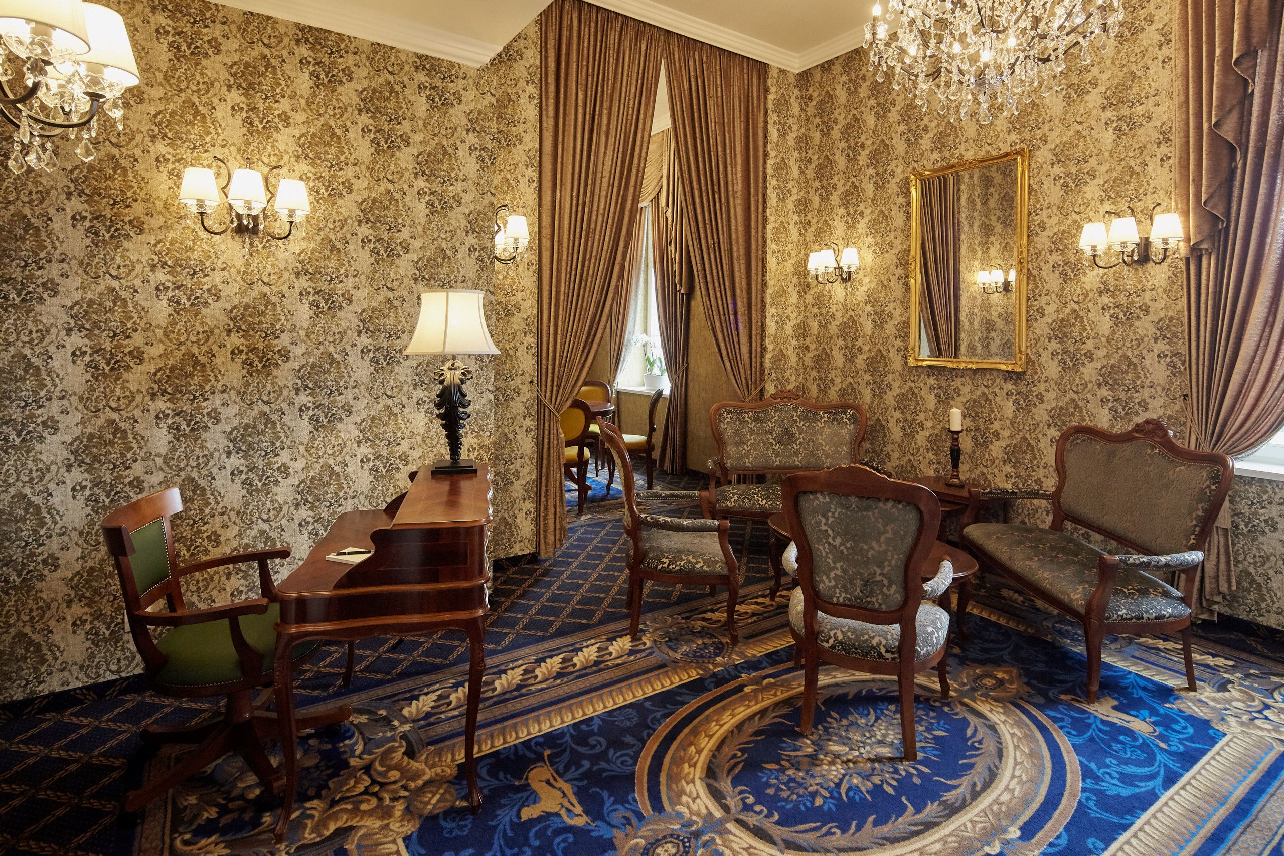 a room with a piano and chairs