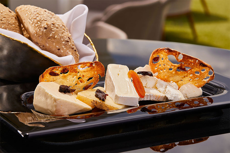 a plate of cheese and bread