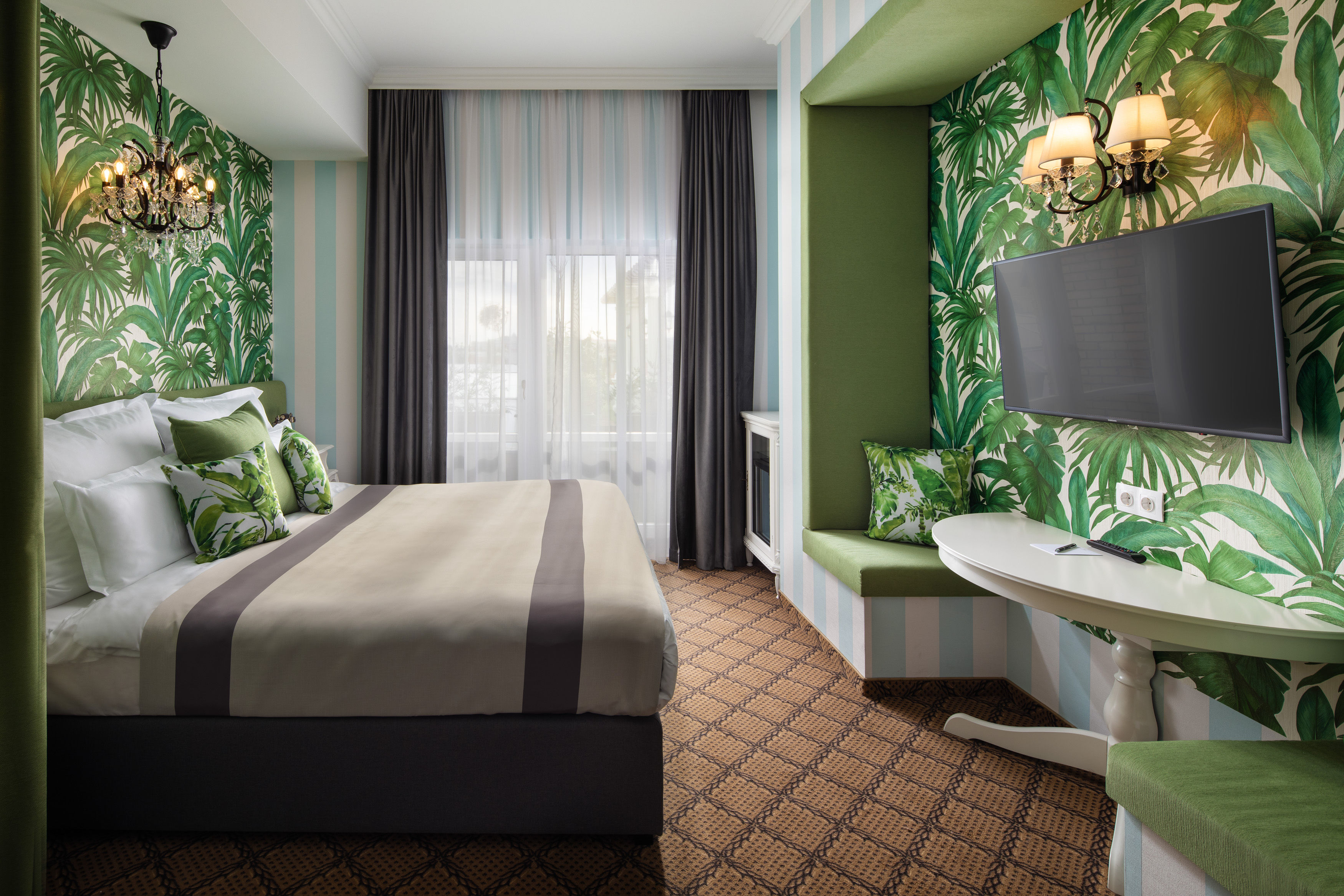a room with a bed and a television