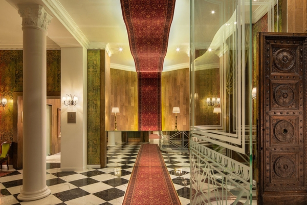 a hallway with a red carpet