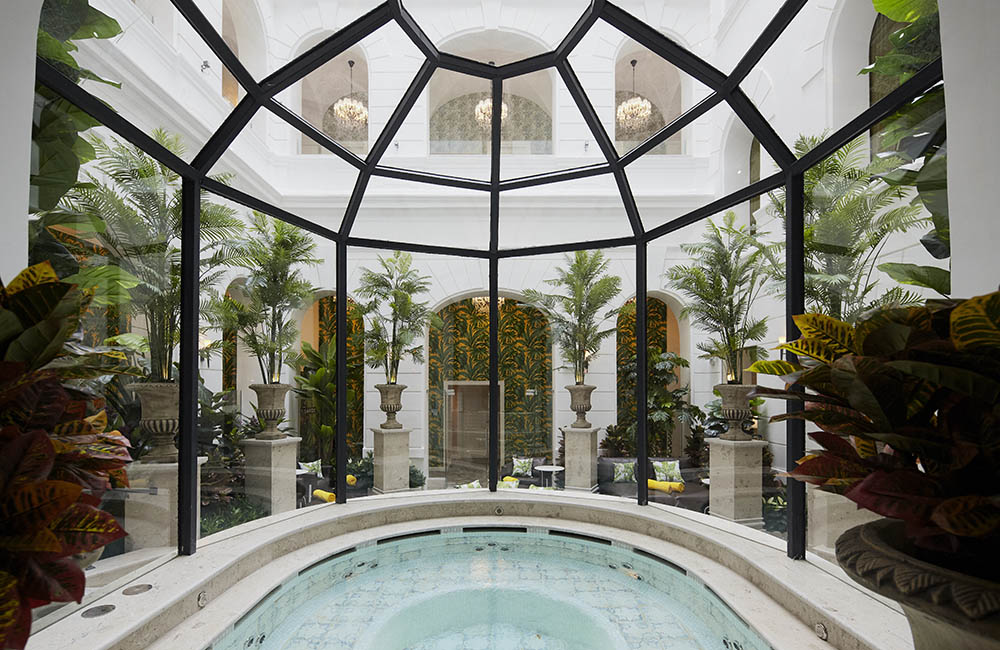 a indoor hot tub with a glass dome