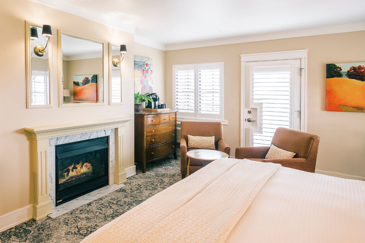 a room with a fireplace and a bed