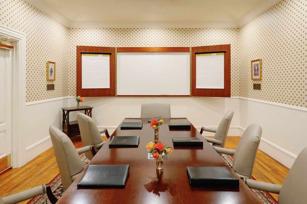 a room with a table and chairs