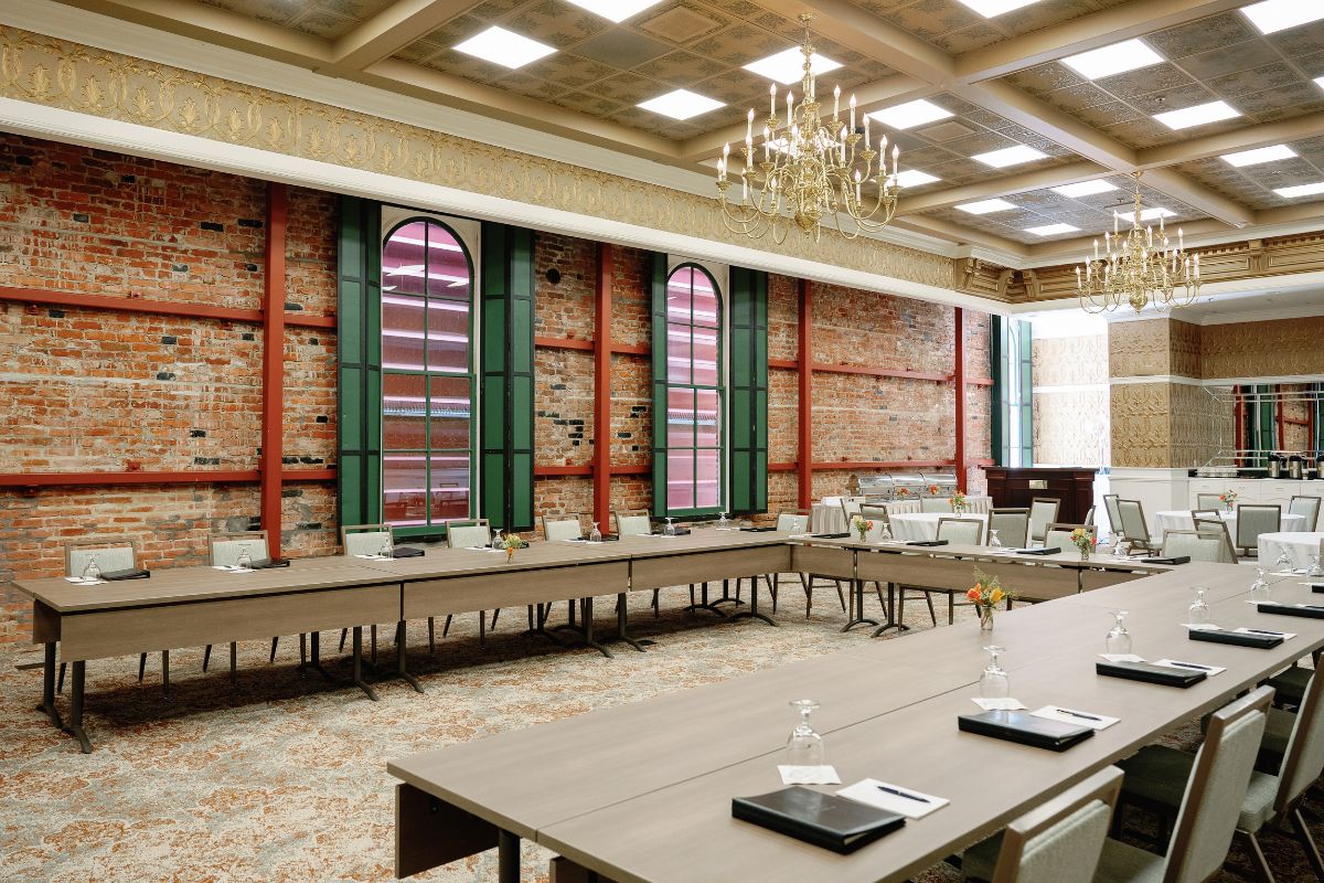 a room with long tables and chairs