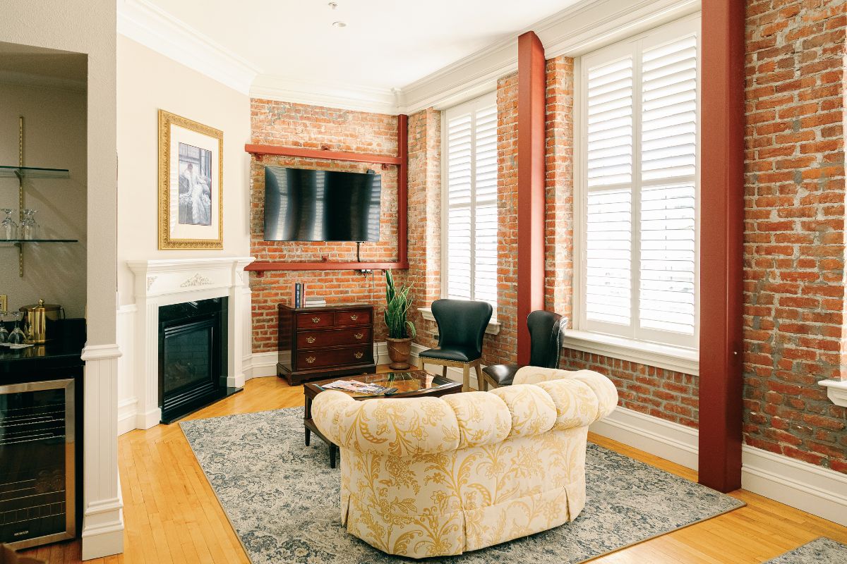 a living room with a fireplace and a couch