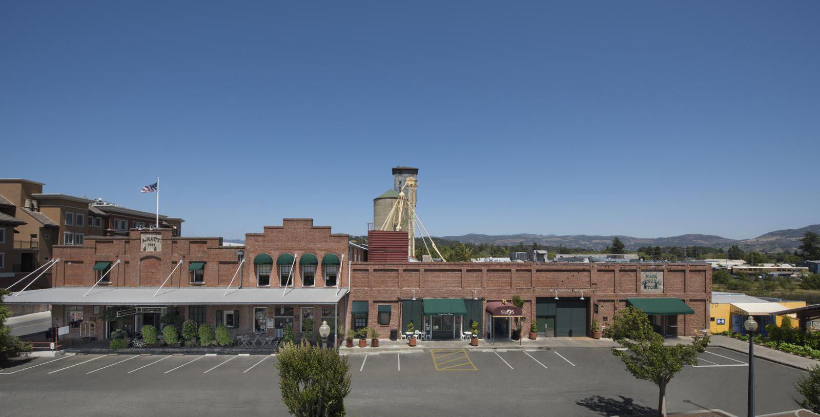 a parking lot with a building in the background