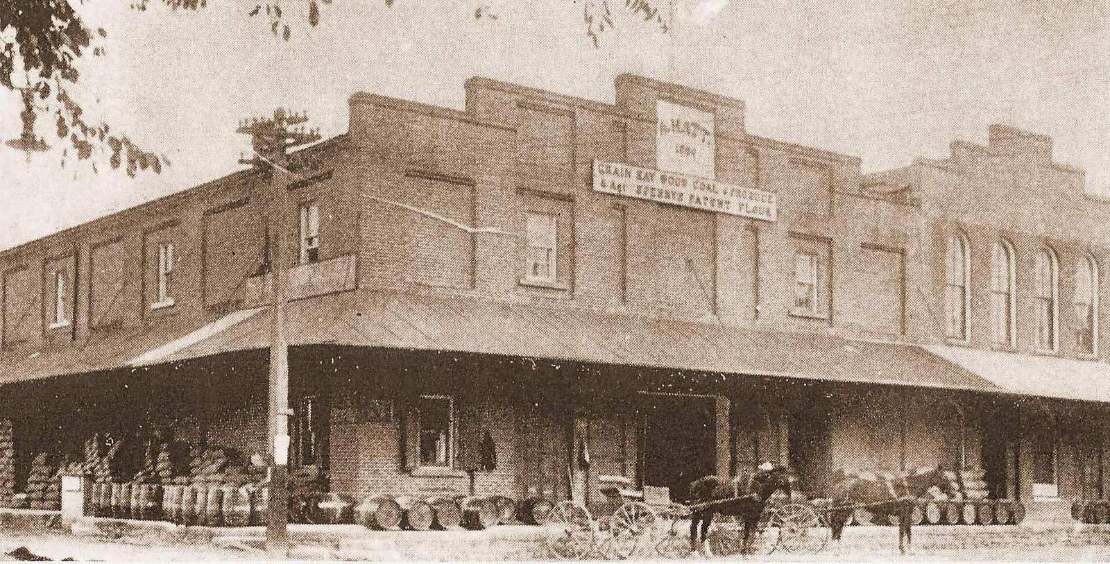 a horse drawn carriage outside a building