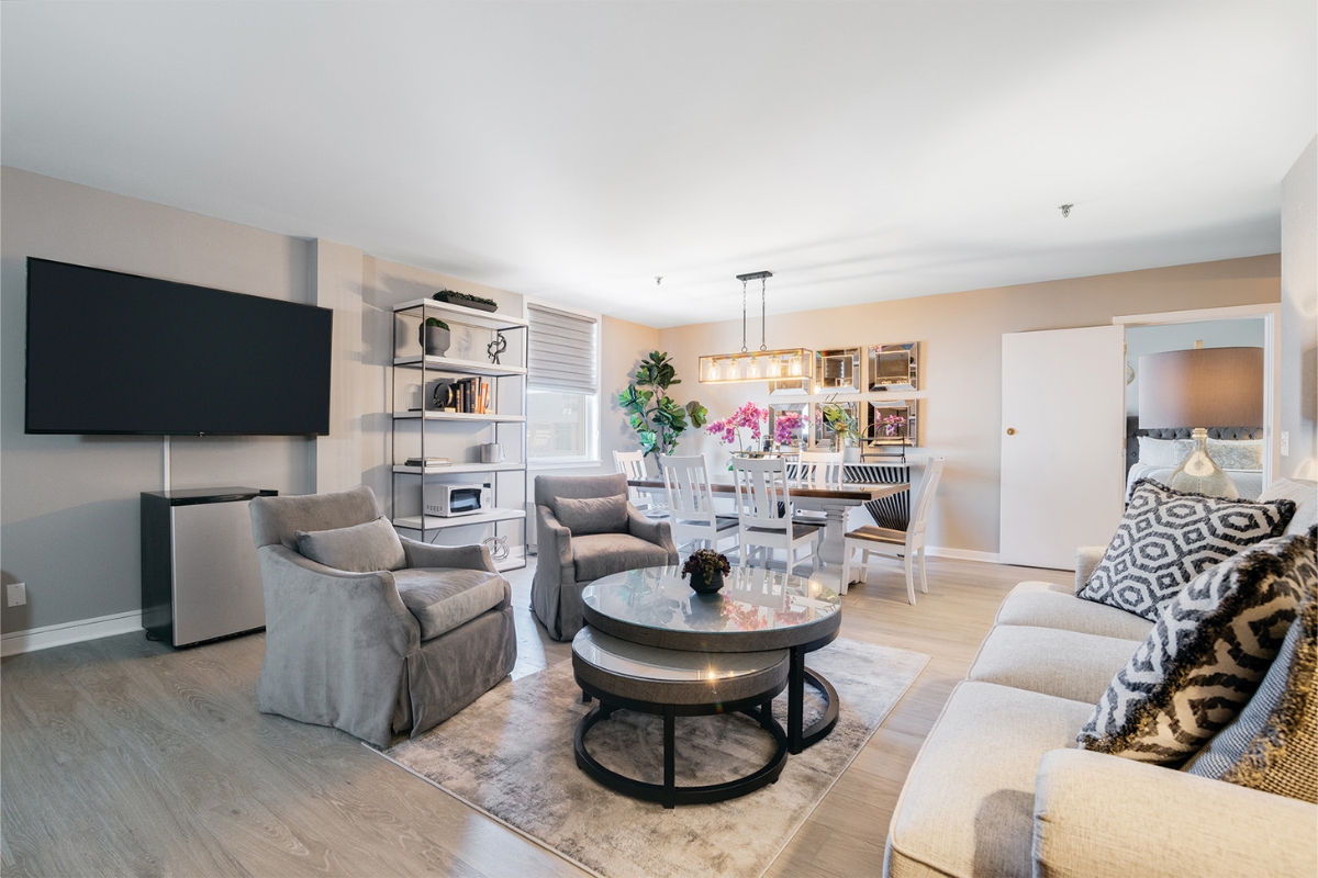 a living room with a table and chairs