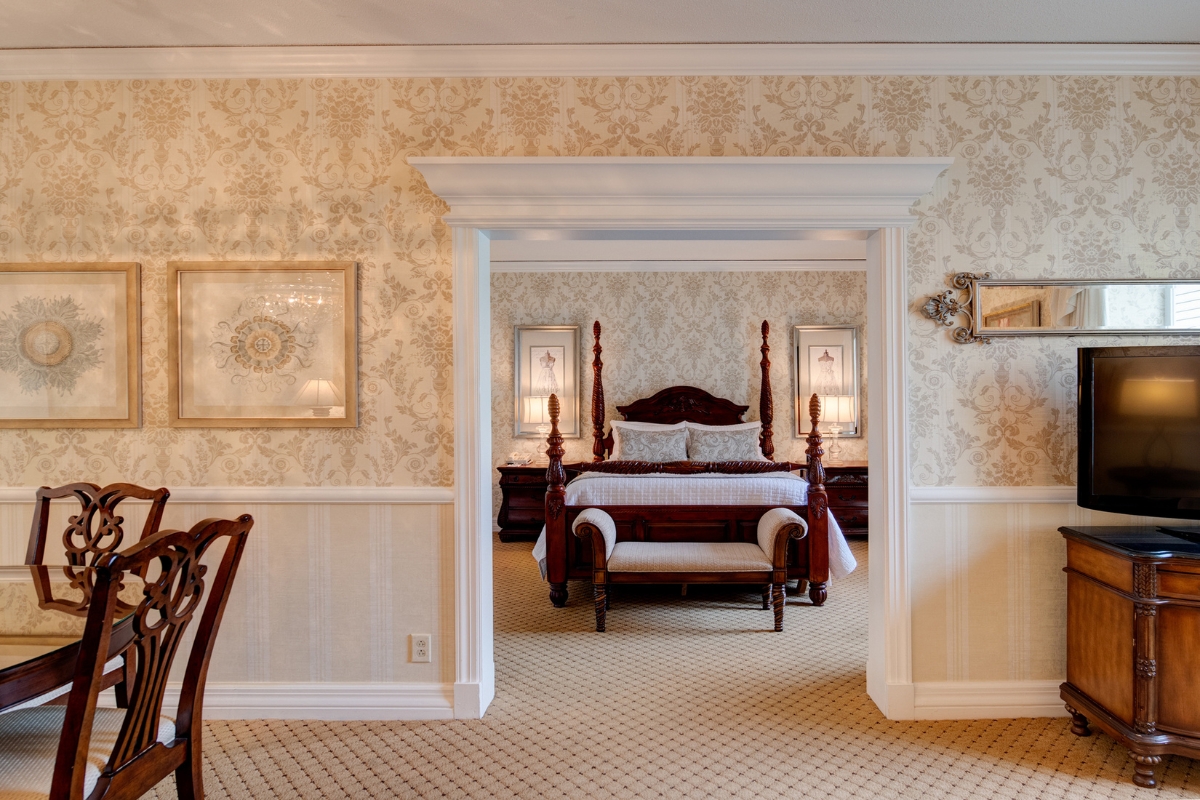 a bedroom with a bed and a chair