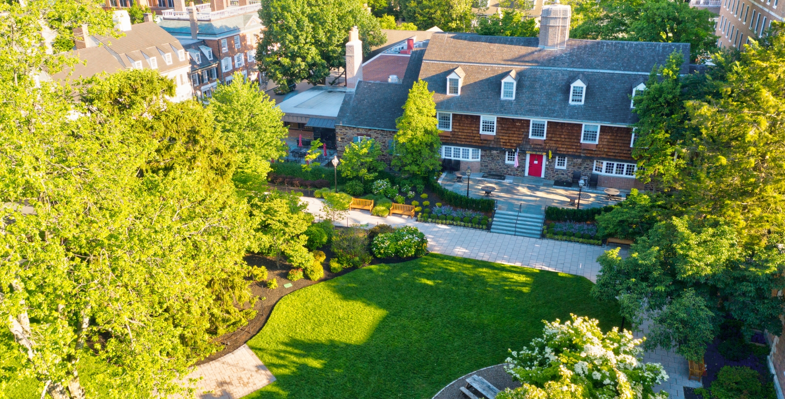 a building with a lawn and trees