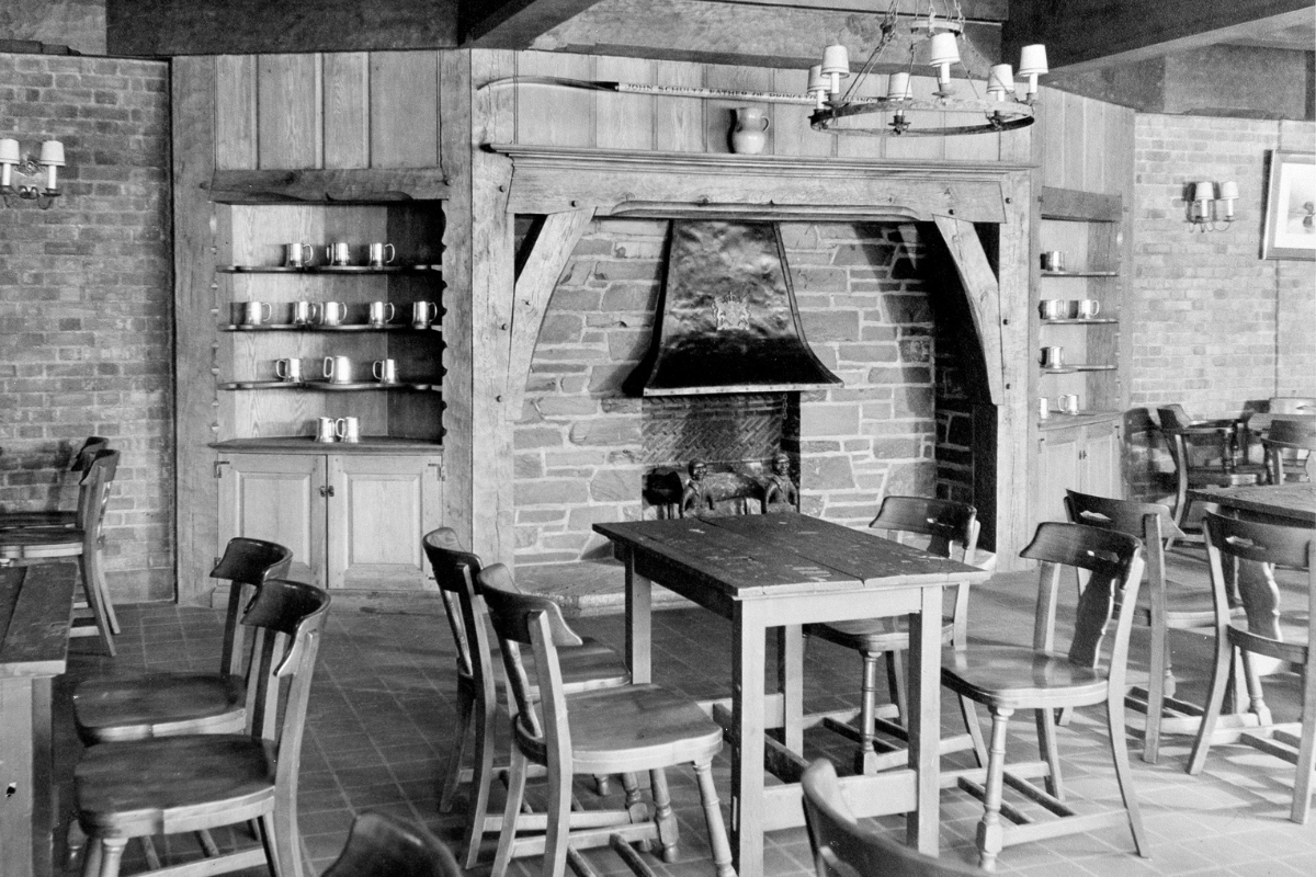 a room with a fireplace and a table