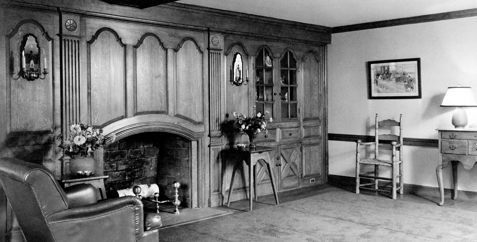 a room with a fireplace and a chair