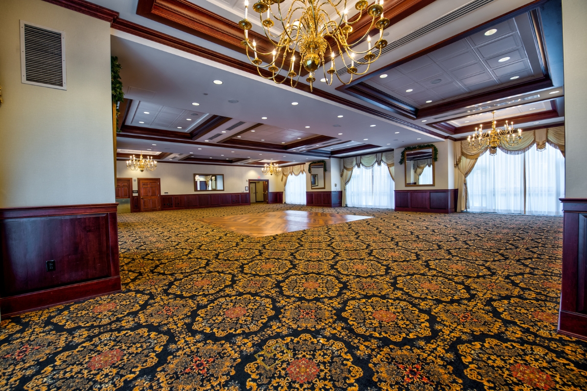 a large room with a chandelier and carpet
