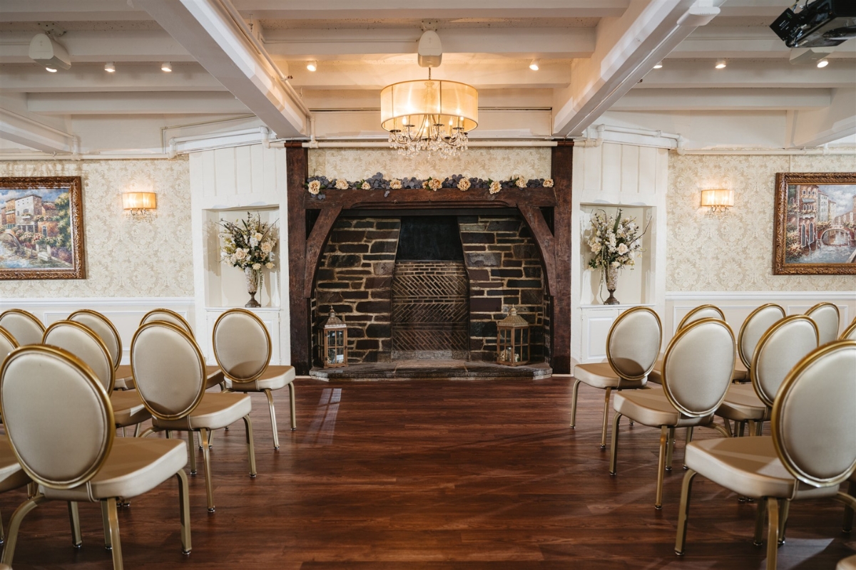a room with chairs and fireplace
