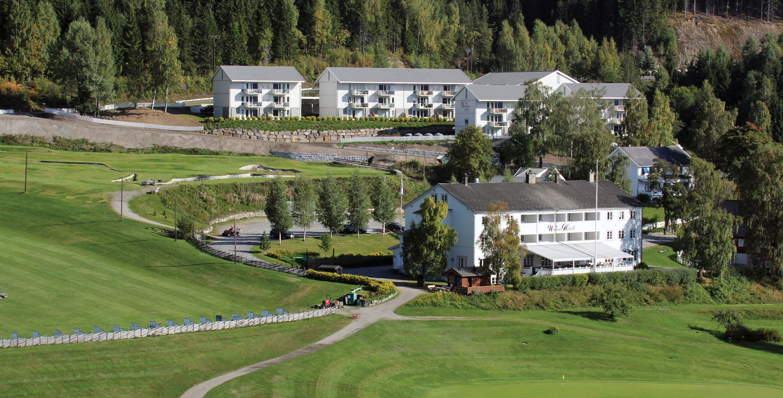 a group of buildings in a golf course