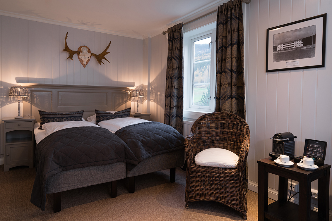 a bedroom with a bed and a chair