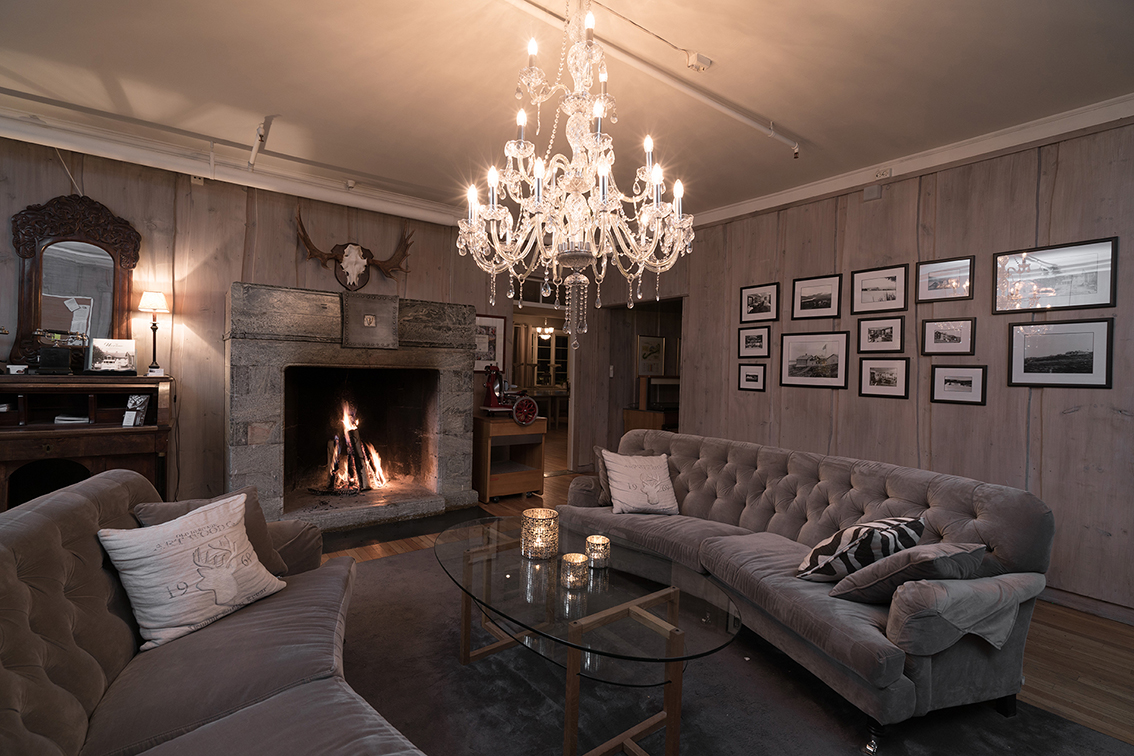 a living room with a chandelier and a couch
