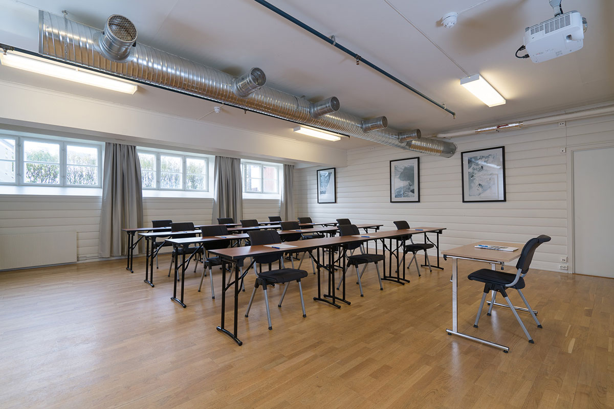 a room with tables and chairs