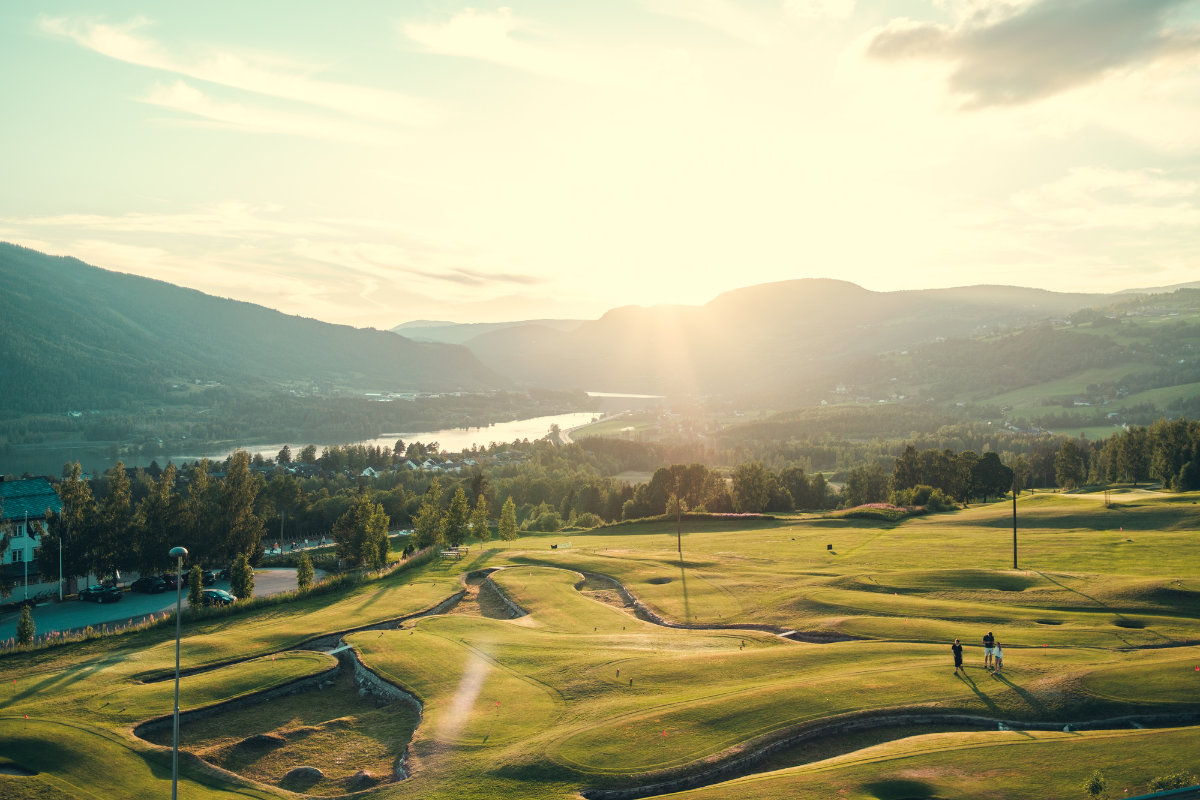 a group of people on a golf course