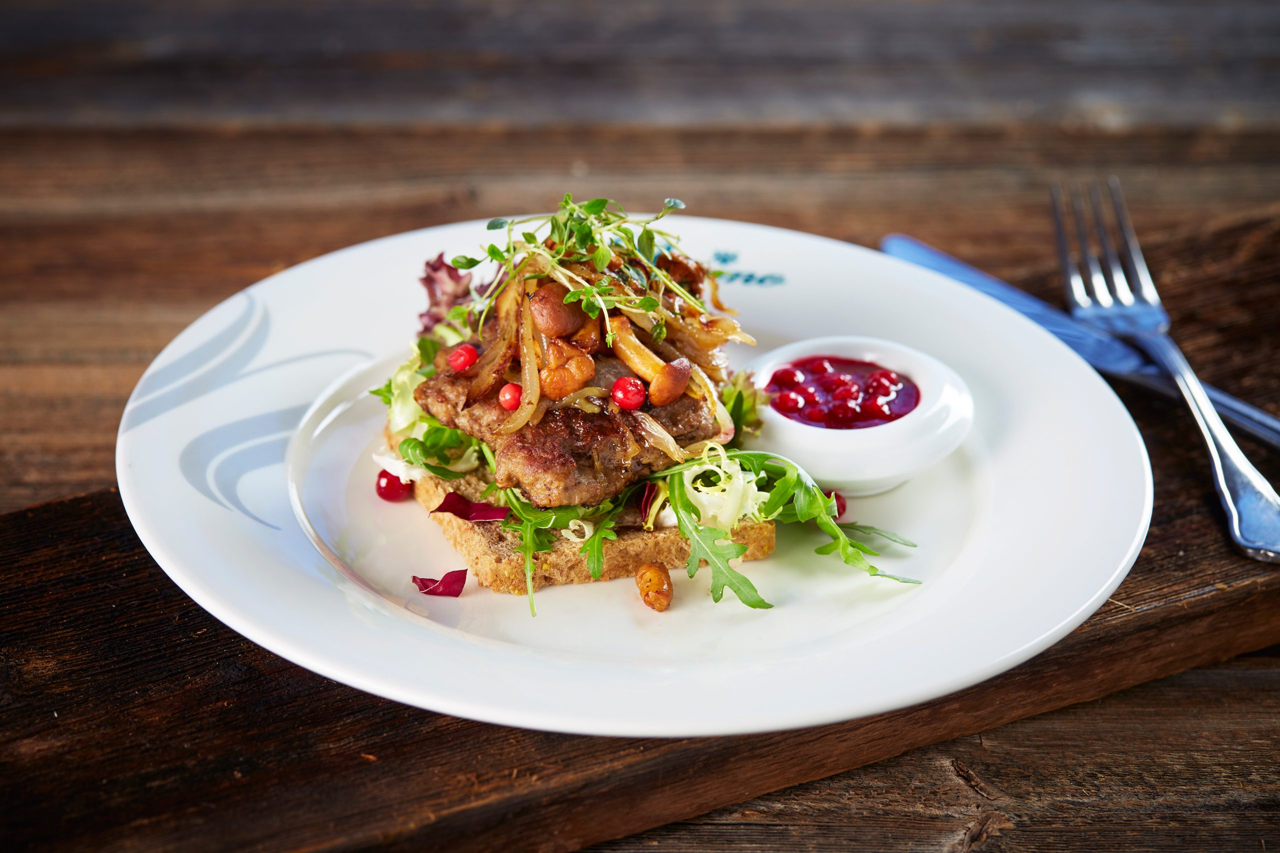 a plate of food on a wood table