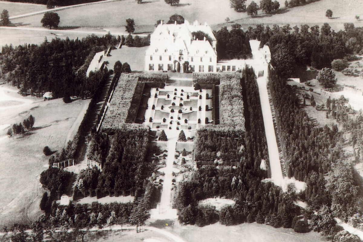 an aerial view of a large white house