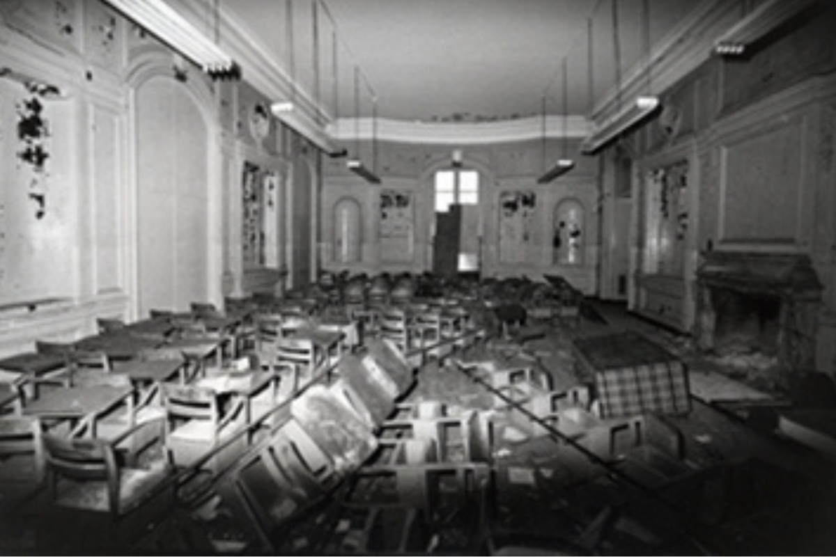 a room with chairs and tables
