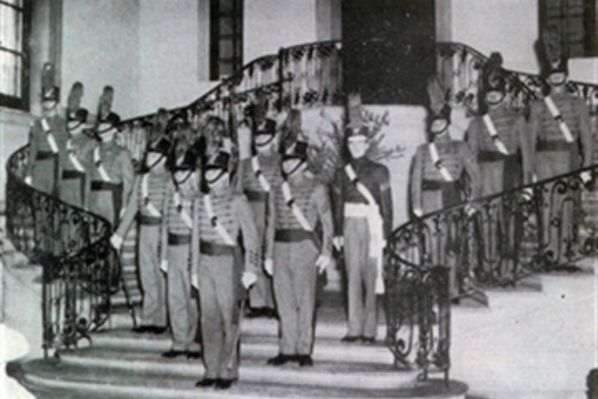 a group of people in uniform standing on stairs