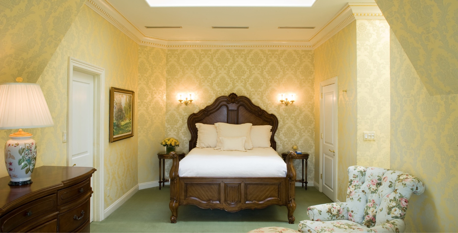 a bedroom with a bed and a chair