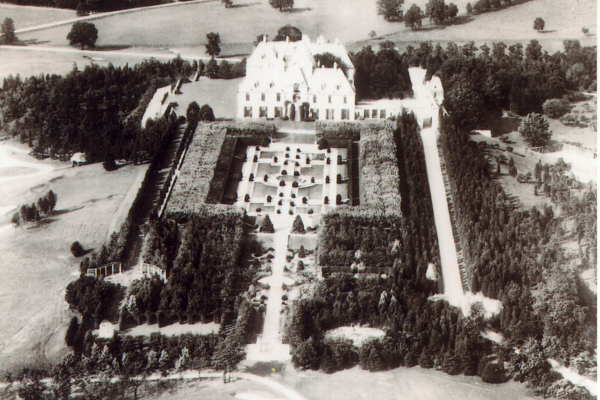 an aerial view of a large white house