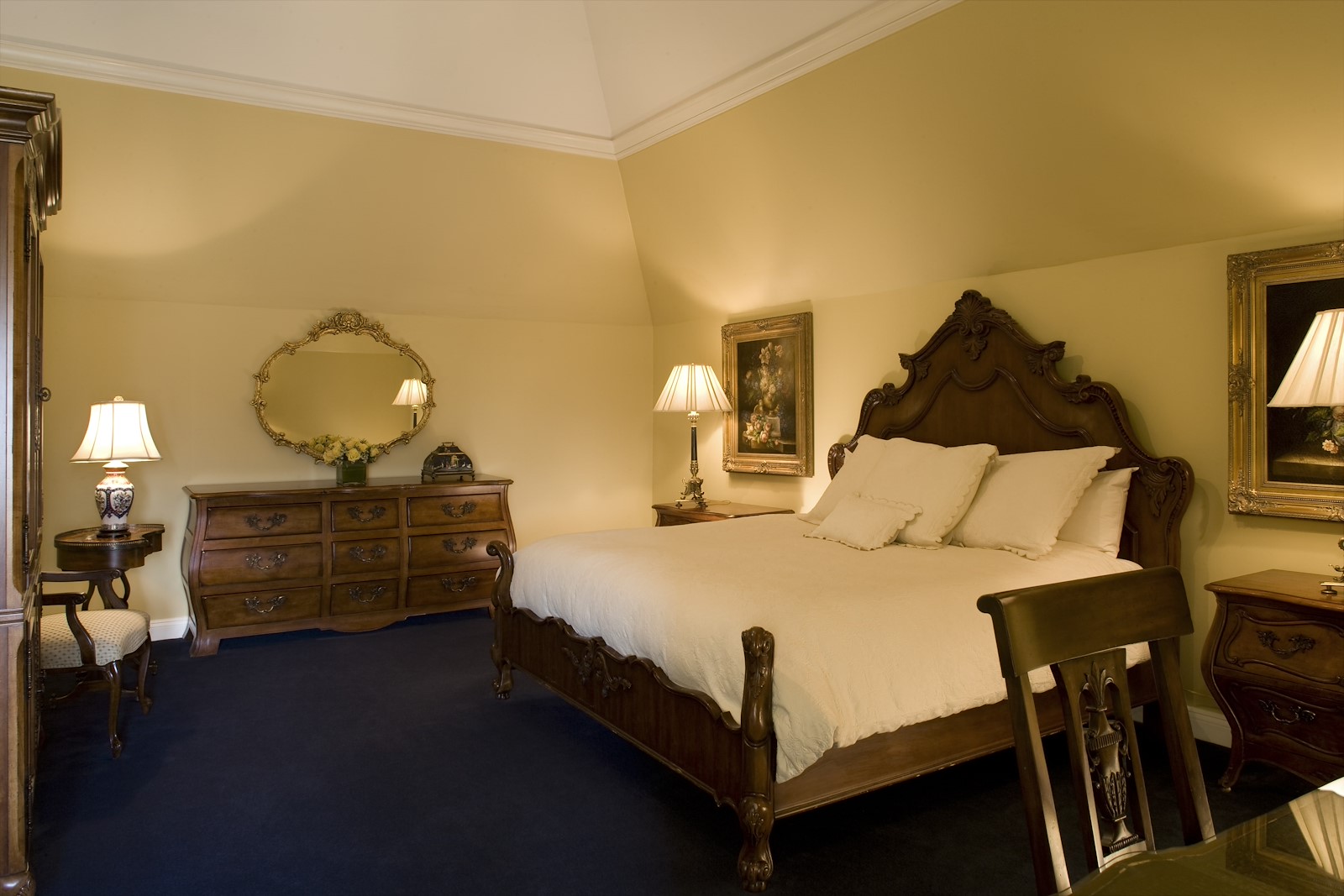 a bedroom with a bed and dresser