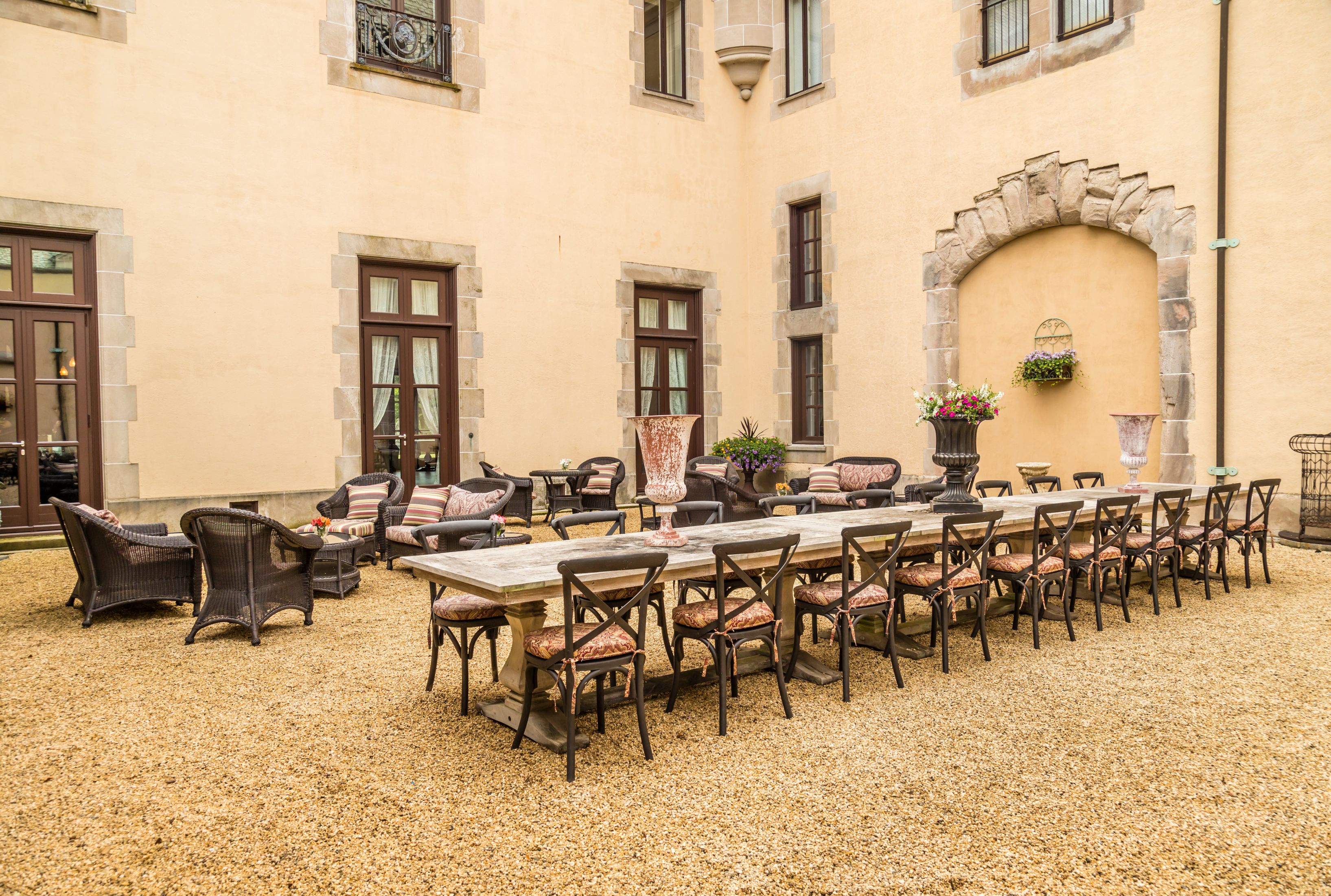 a patio with a table and chairs