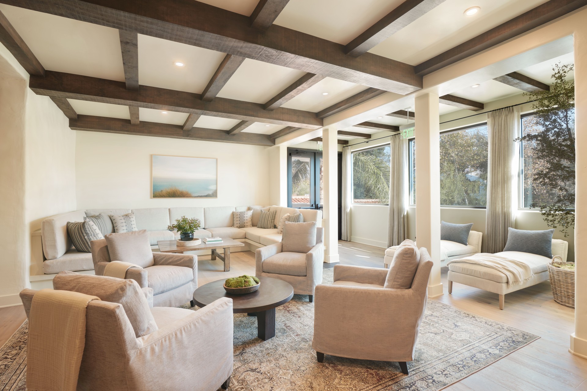 a living room with a couch and chairs